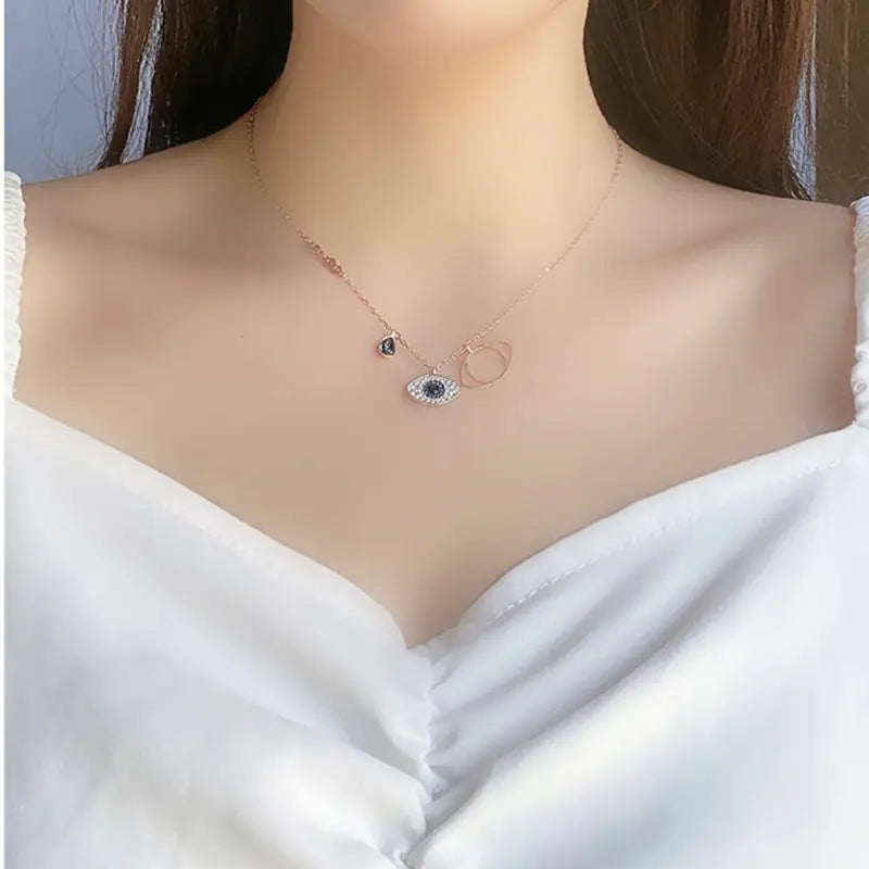 Evil Eye Necklace with Blue Crystal and Key Design